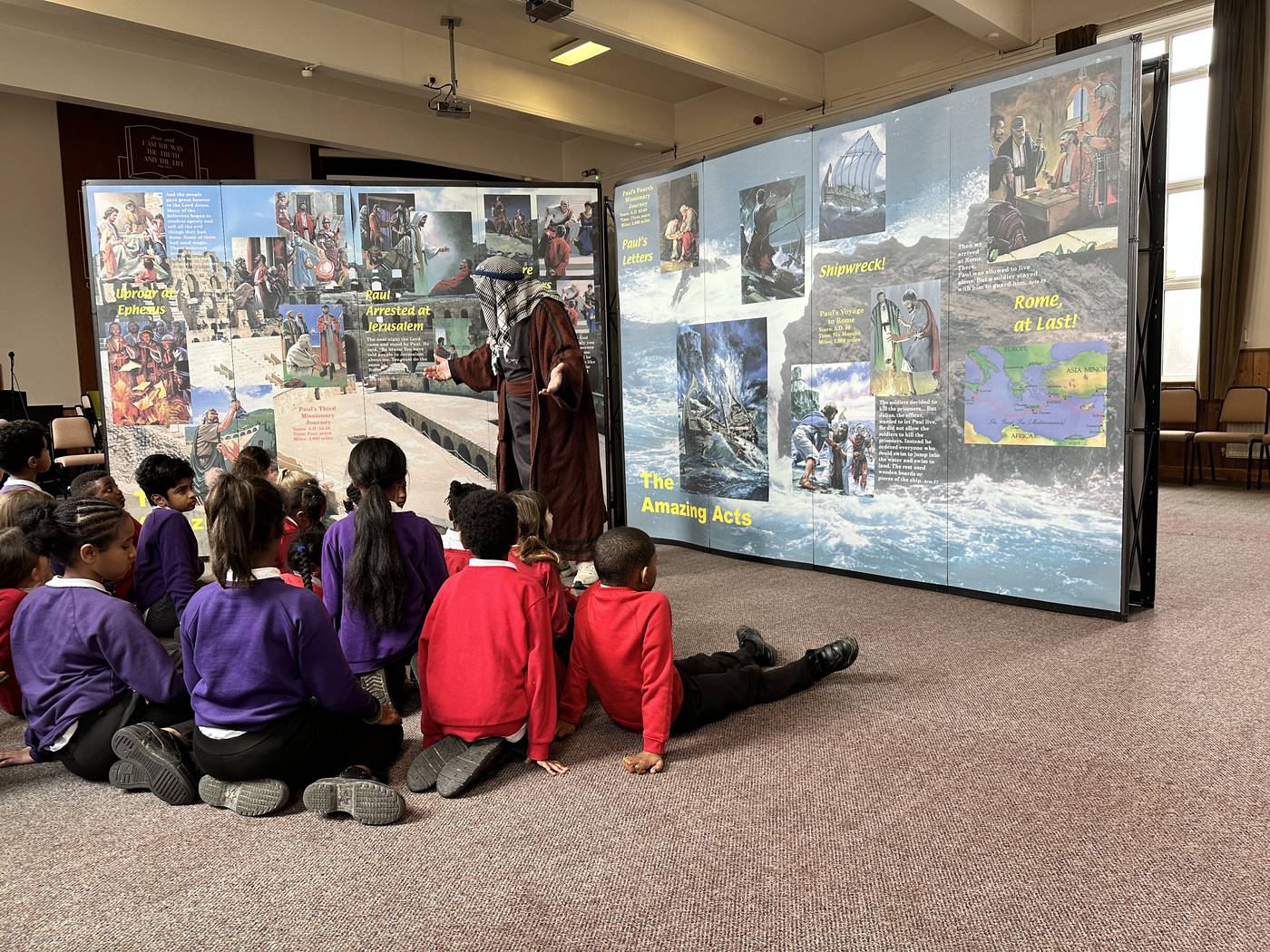 Younger pupils listening to Bible teaching