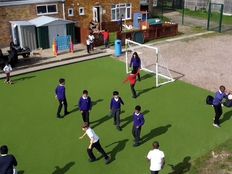 Pupils playing football at breaktime